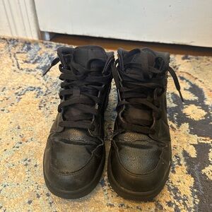 All black mid Jordan 1s